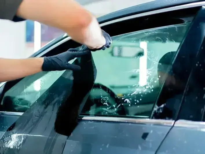 mobile windshield repair technician fixing a rock chip near The Landing in Renton WA