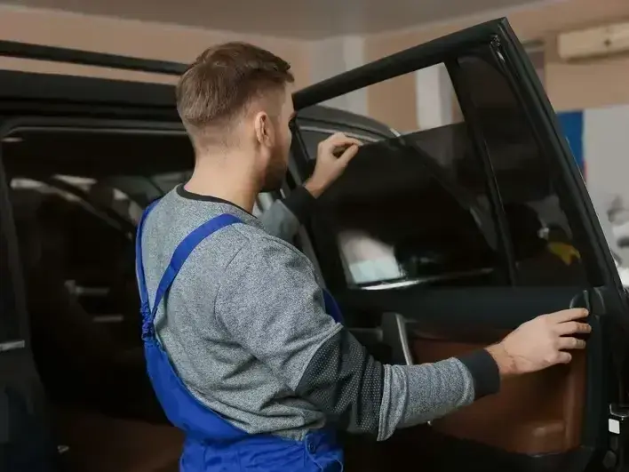 windshield replacement service van parked by homes near Saint Edward State Park in Kenmore